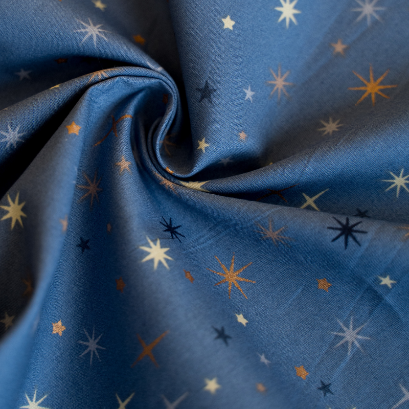 Baumwolle Weihnachtsstoff funkelnde Sterne auf blau