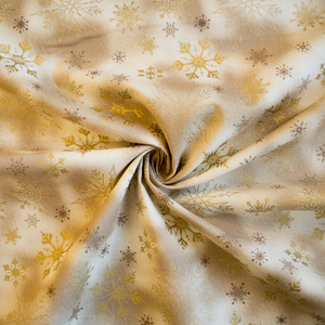 Baumwolle Schneeflocken in gold auf beige