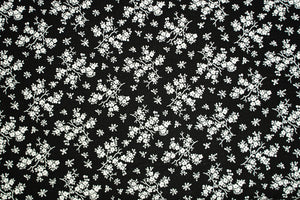 Baumwollstoff Serie Mix & Match kleine Blüten in altweiß auf schwarz