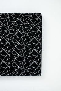 Baumwollstoff weißes graphisches Muster auf schwarz