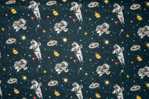 Baumwollstoff Astronauten auf schwarzblau